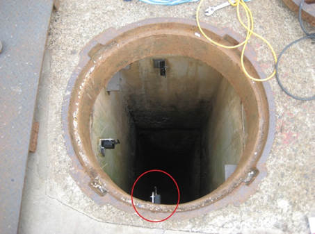 Wireless Vibration/Acceleration SenSpot sensor installed in a manhole