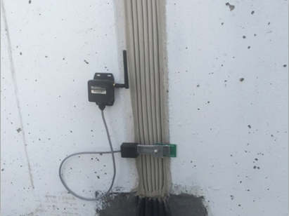 Wireless strain (stress) gauge SenSpot sensor installed over a expansion absorber