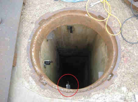 Wireless Vibration/Acceleration SenSpot sensor installed in a manhole