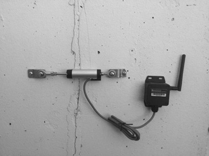 Wireless Displacement/Crack Meter SenSpot installed over a crack inside a building